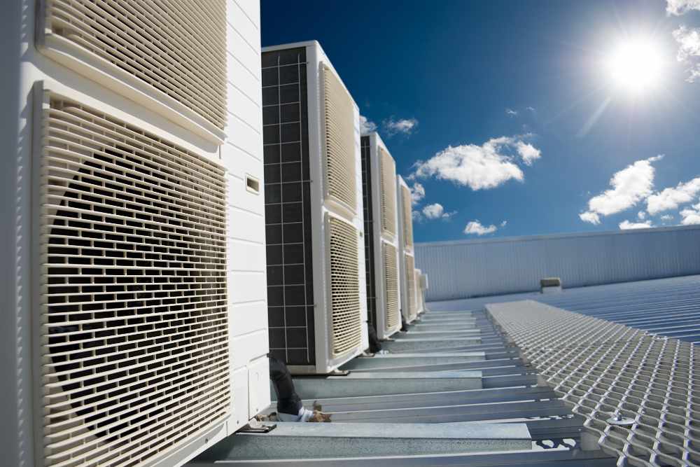 Commercial HVAC units installed on a rooftop under a clear blue sky